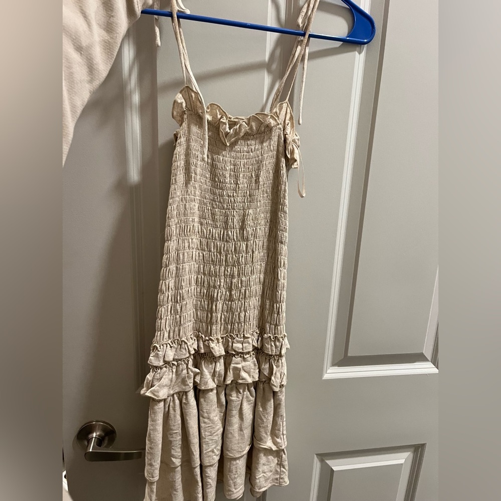 Small cream form fitting mini dress